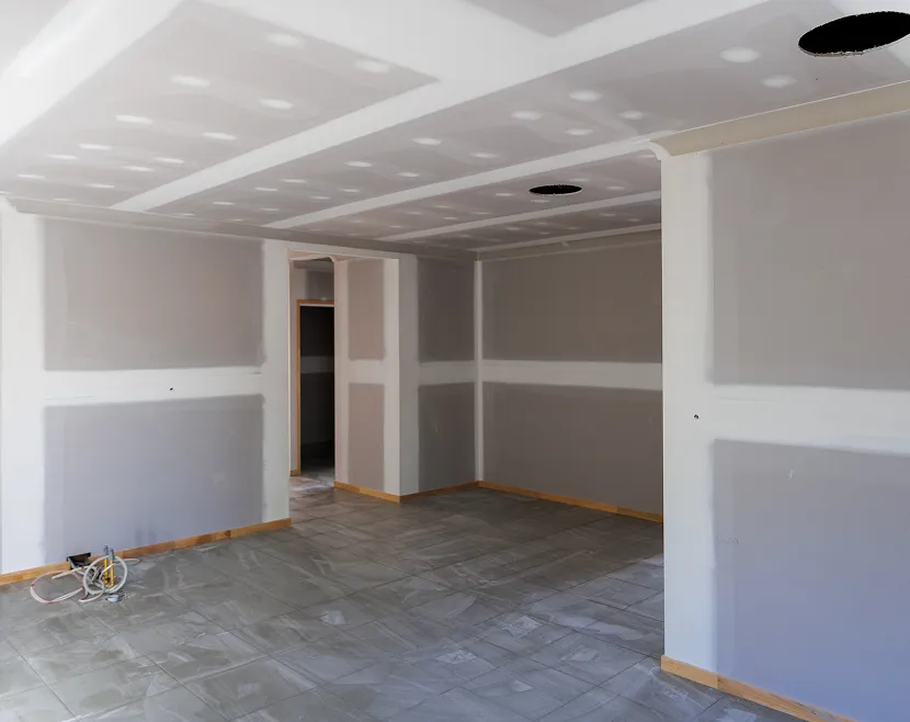 Unfinished room with drywall and tiled floor.