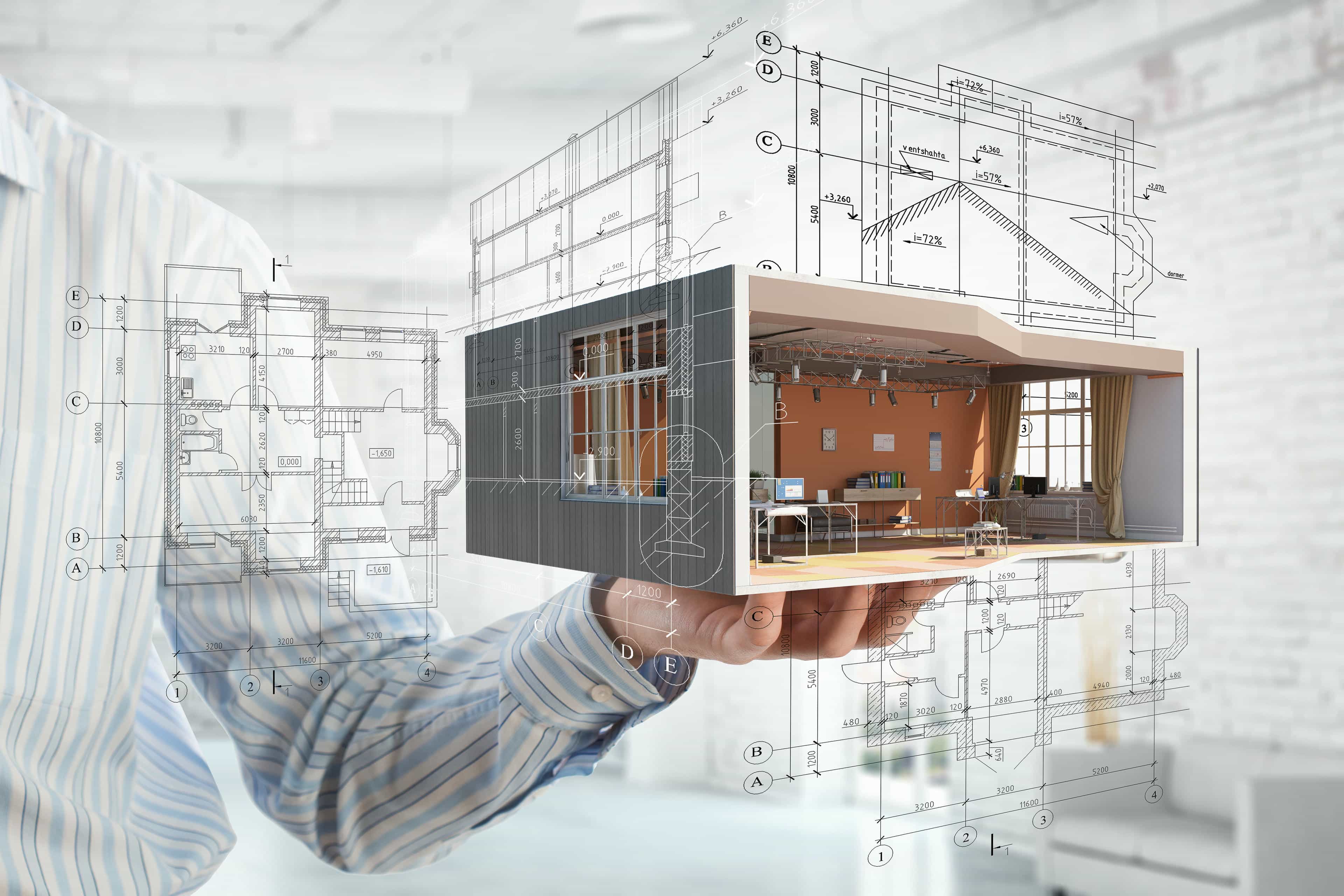 Hand holding architectural model with blueprints.